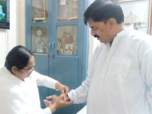 B.K. Preeti tying Rakhi to SDM Bijawar Ravindra Chouksey